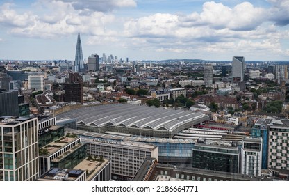 Looking Down On Waterloo Train Station From The London Eye In August 2022.  The Shard And Further Back Still Canary Wharf Can Be Seen In The Background Peaking Above The London Skyline.