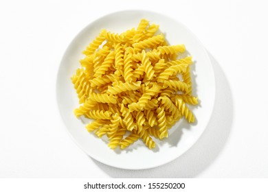 Looking Down At A Plate Of Properly Cooked Pasta / Top View Of Macaroni Noodles On White Ceramic Plate 