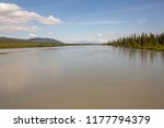 Looking down the Sustina River towards the Alaska Range from the iconic Denali Highway on a warm and sunny day. Alaska.