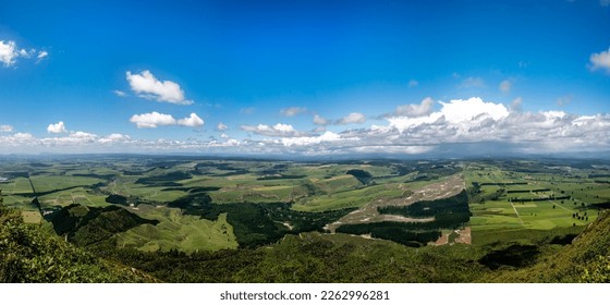 Looking down from the top of the volcano called Mt Tuahara onto rural farmland and agricultural fields near Lake Taupo