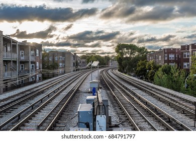 Looking Down The Tracks Of The Chicago El With Clouds