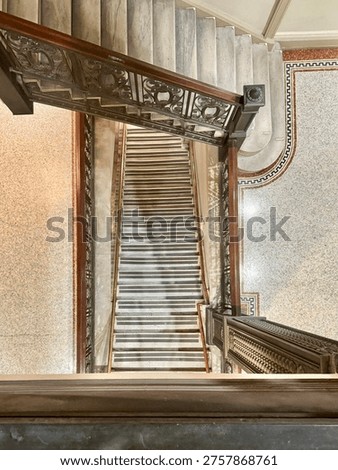 Looking down at two old staircases in an office building in the Flatiron District in Manhattan, New York City