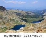 looking down at the upper and lower chicago lakes from the hiking trail to the summit of mount evans, colorado