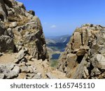 looking down at the upper and lower chicago lakes from the hiking trail to the summit of mount evans, colorado