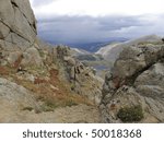 looking down at the upper and lower chicago lakes from the hiking trail to the summit of mount evans, colorado