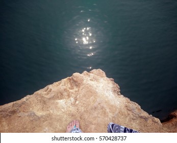 Looking down when standing at the edge of cliff