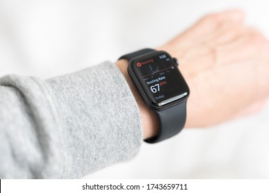 Looking Down At Woman's Hand Wrist Wearing Black Apple Watch A Health Fitness Watch Tracker To Monitor Heart Rate, Activity Levels, Execise Fitness Movement. Keeps You Fit And Motivated. Modern 