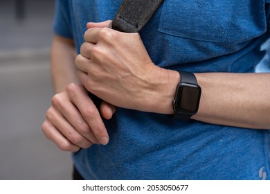 Looking Down At Woman's Hand Wrist Wearing Black Apple Watch A Health Fitness Watch Tracker To Monitor Heart Rate, Activity Levels, Exercise Fitness Movement. Keeps You Fit And Motivated.