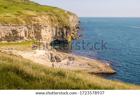 Looking East along the Jurassic Coast with the famous Dancing Ledge near Langton Matravers, Swanage, Dorset, UK on a warm and sunny Summer afternoon