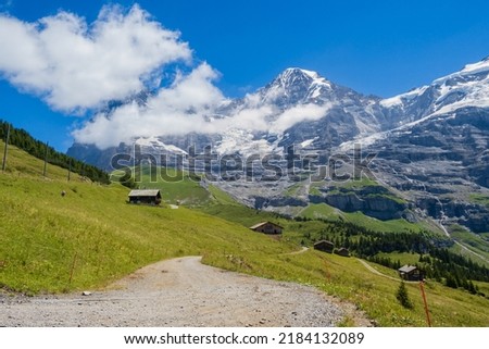 Looking at the Eiger whilst hiling to Wengen from Kleine Scheidegg in the Berneses Oberland of Switzerland