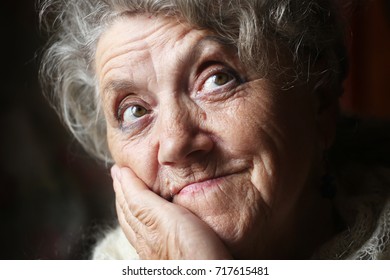 Looking elderly woman portrait - Shutterstock ID 717615481