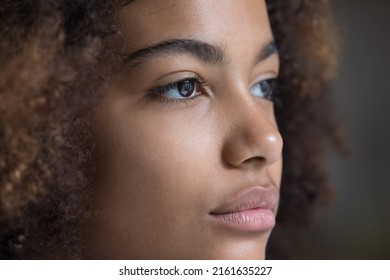 Looking Forward. Close Up Face Teen Afro American Lady Staring Far Away. Brown Eyes Of Serious Young Woman Wearing Modern Soft Contact Lenses. Female Patient Enjoy Good Eyesight After Laser Correction