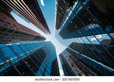 Looking Up At High Rise Office Building Architecture Against Blue Sky In The Financial District Of Toronto In Ontario, Canada, Business And Finance Concept.