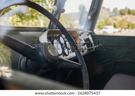 Looking inside the cabin of a simple old military transport van, bare interiors, rugged vehicle