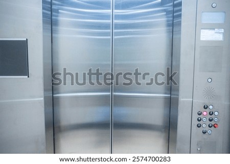 Looking from inside an elevator to the outside with the doors closed 001