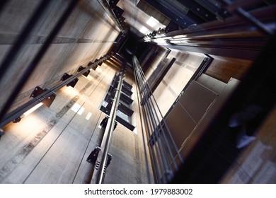 Looking Inside an Elevator Shaft - Shutterstock ID 1979883002