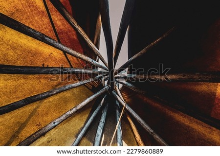 Looking up inside of a teepee
