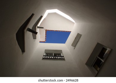 looking up the inside of a tower of a residential structure