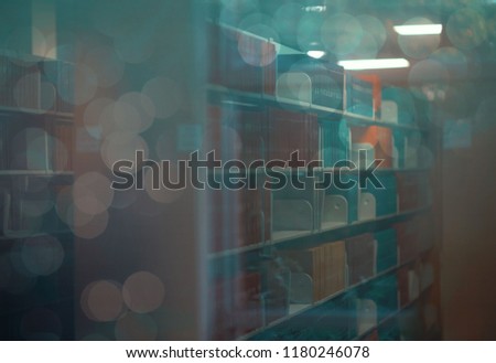 looking into a library- view of a library at night from the perspective of someone on the outside 