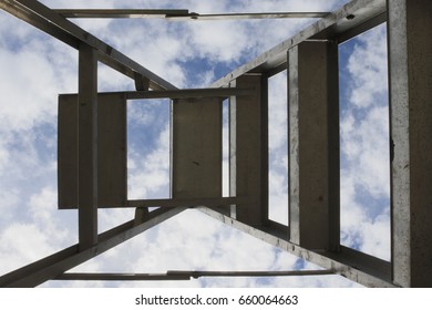 Looking up at a ladder with a background of sky