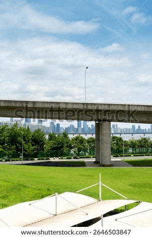 Looking up at a Large Interstate Highway Overpass and Blue Sky