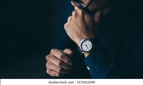 looking at luxury watch on hand check the time low key tone on black backgrond.concept for managing time organization working,punctuality,appointment.man fashionable wearing stylish - Powered by Shutterstock