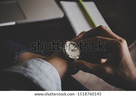 Similar – Image, Stock Photo Woman calling on phone wearing blue dress and silver wristwatch