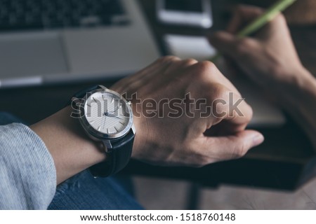 Similar – Image, Stock Photo Woman calling on phone wearing blue dress and silver wristwatch