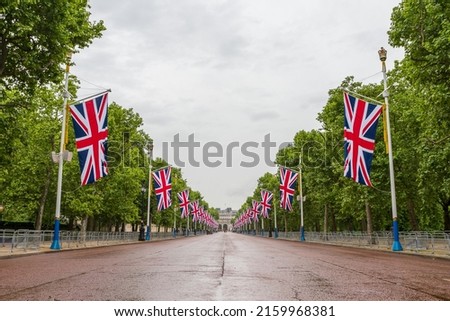 Looking up The Mall towards Admiralty Arch during preparations for the Queens Platinum Jubilee celebrations, lined with Union Jack flags in May 2022.
