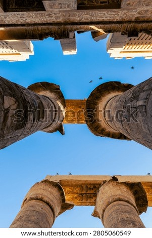 Looking Up at Massive Papyrus Columns and Architraves in Karnak Temple