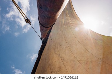 Looking up the mast to the sail of a traditional dhow, wooden fishing boat, in Lamu Island, Kenya