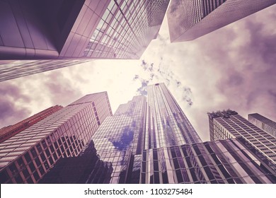 Looking up at New York City skyscrapers, vintage colors applied, USA.  - Shutterstock ID 1103275484