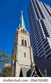 Looking Up At Old Church Steeple In Downtown City