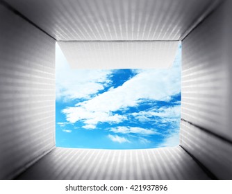 Looking On Blue Sky. Thinking Outside The Box Concept