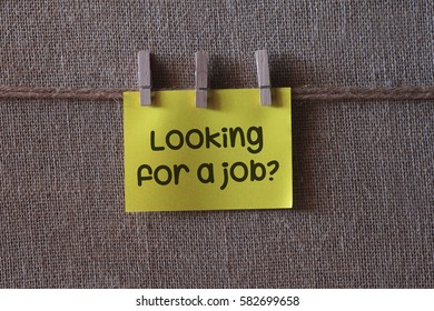 Looking for a job? on yellow sticky note