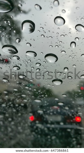 Looking out from car Raining outside Blur photo,\
Focus water dripping