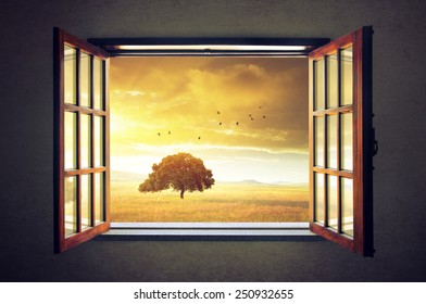 Looking out an open window to a sunny spring countryside landscape