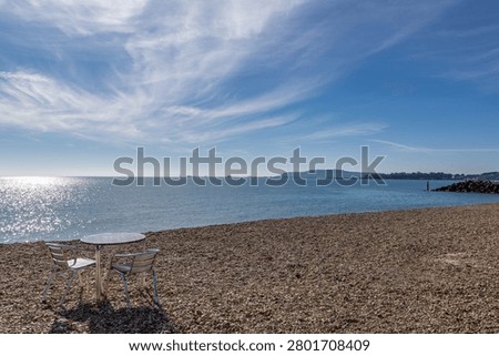 Looking out over the pebble beach at Weymouth, on a sunny spring day