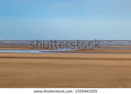 Looking out over the vast sandy beach towards the ocean, at Formby in Merseyside