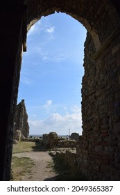 Looking Out Of The Remains Of An Old Relic To The Beautiful Blue Sky