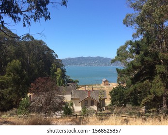 Looking Out At San Francisco Bay And Mainland From Angel Island, Over Structures From When Angel Island Was An Internment Camp And Gateway To America For Immigrants.