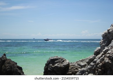 Looking Out From The Sea Saw A Boat Passing By