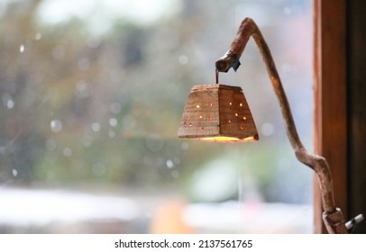 Looking Out The Snowy Window With A Cute Lamp