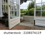 Looking out through a doorway of a garden conservatory