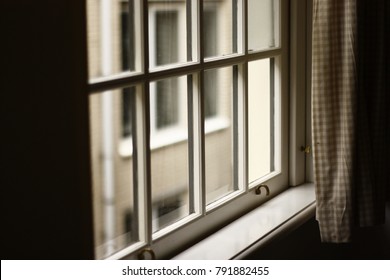 Looking out the window.