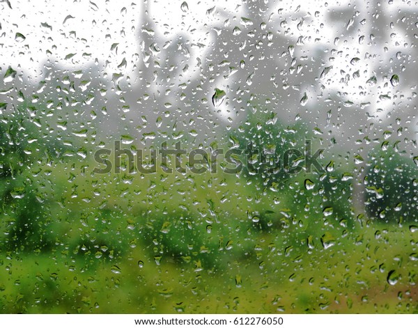 looking outside pass the mirror when\
having rain to see the raindrop and blurred\
background