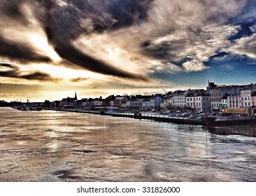 Looking Over Across The River At Sunrise To Waterford Town