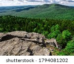Looking over a cliff on North Pack Monadnock towards Pack Monadnock in Greenfield NH.