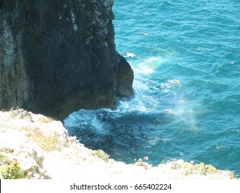 Looking Over The Edge Of The Cliff