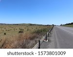 Looking over the fields from the side of the road